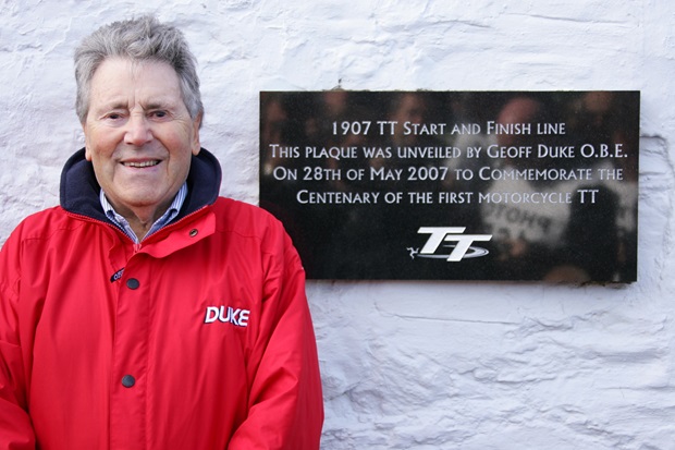 Geoff Duke unveils a plaque to commemorate the centenary of the Isle of Man TT